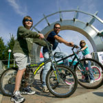 A family riding bikes in Town Square in Family Friendly Grand Forks North Dakota Friendliest Place in the USA