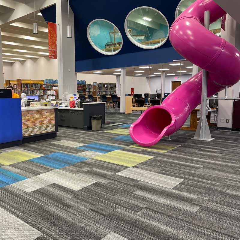 Pink twisty-slide in Grand Forks Public Library