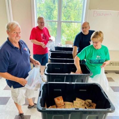 Volunteers packing food bags in Grand Forks, ND a group of volunteers packing bags in Grand Forks, North Dakota