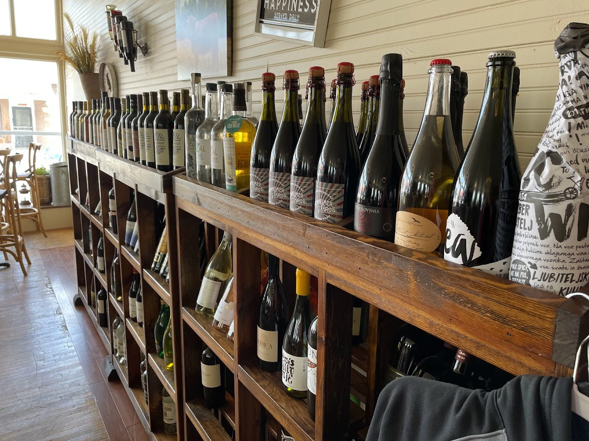 wine-in-grand-forks-trading-post Rack of wine bottles at Last Chance Trading Post in the Grand Forks Region