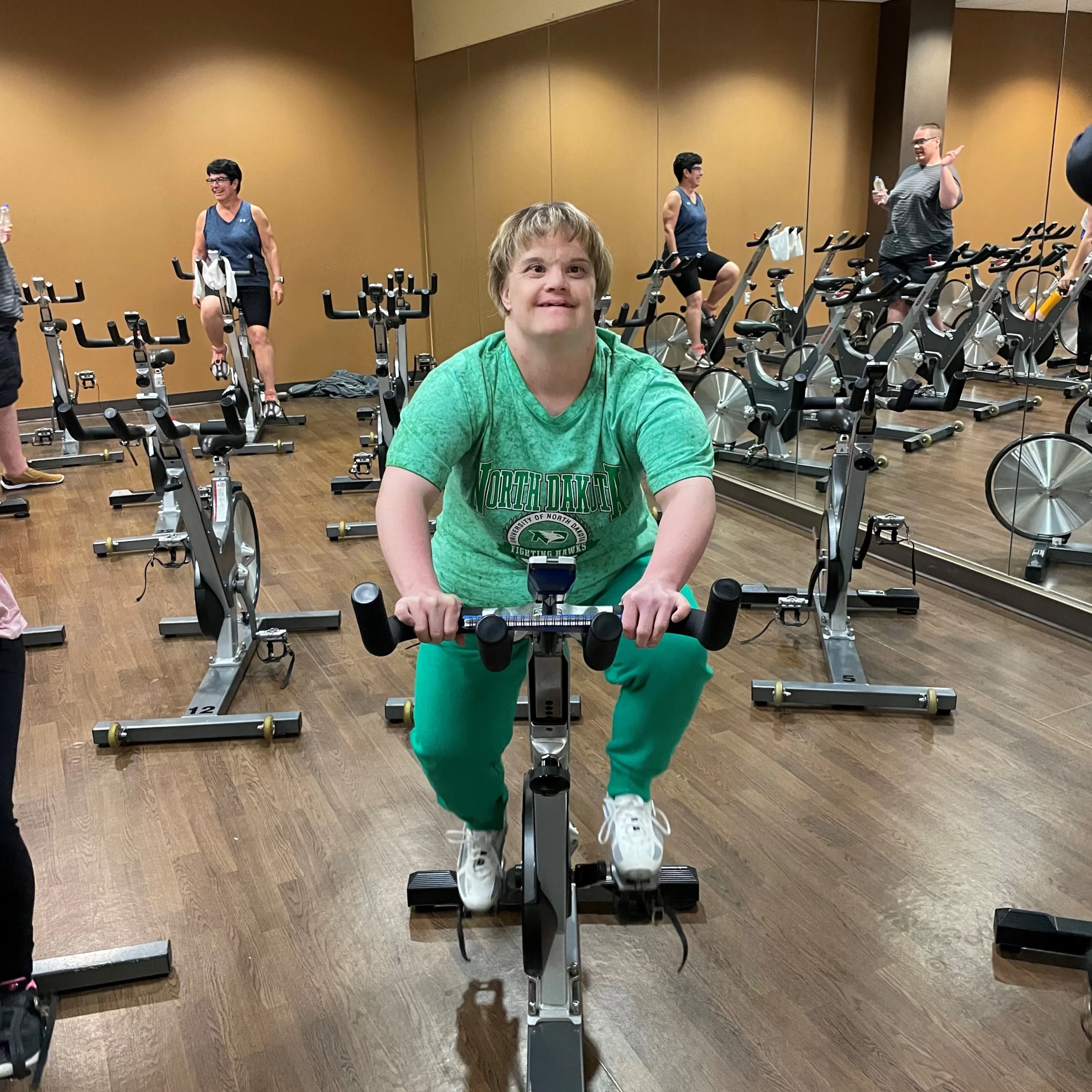 erin-bike-grand-forks Erin taking a spin class in Grand Forks.