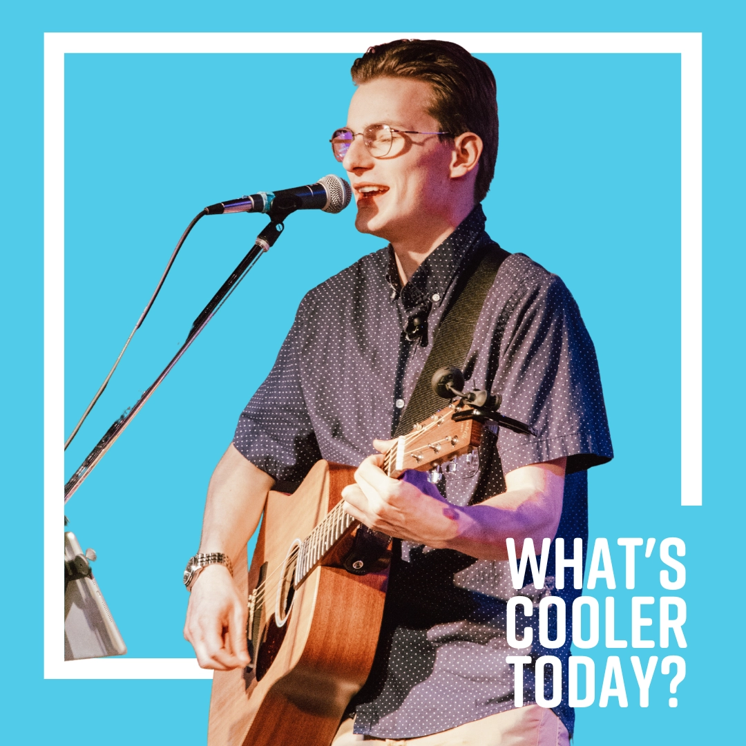 andy-cooler-headshot 'What's Cooler Today?' Author Andy singing in front of blue background.