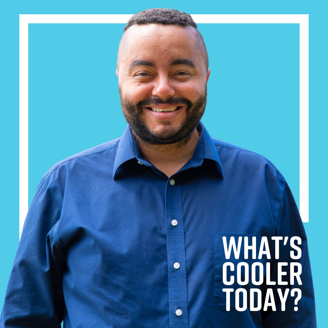 Ken Cooler Headshot "What's Cooler Today?" author Ken in front of blue background.