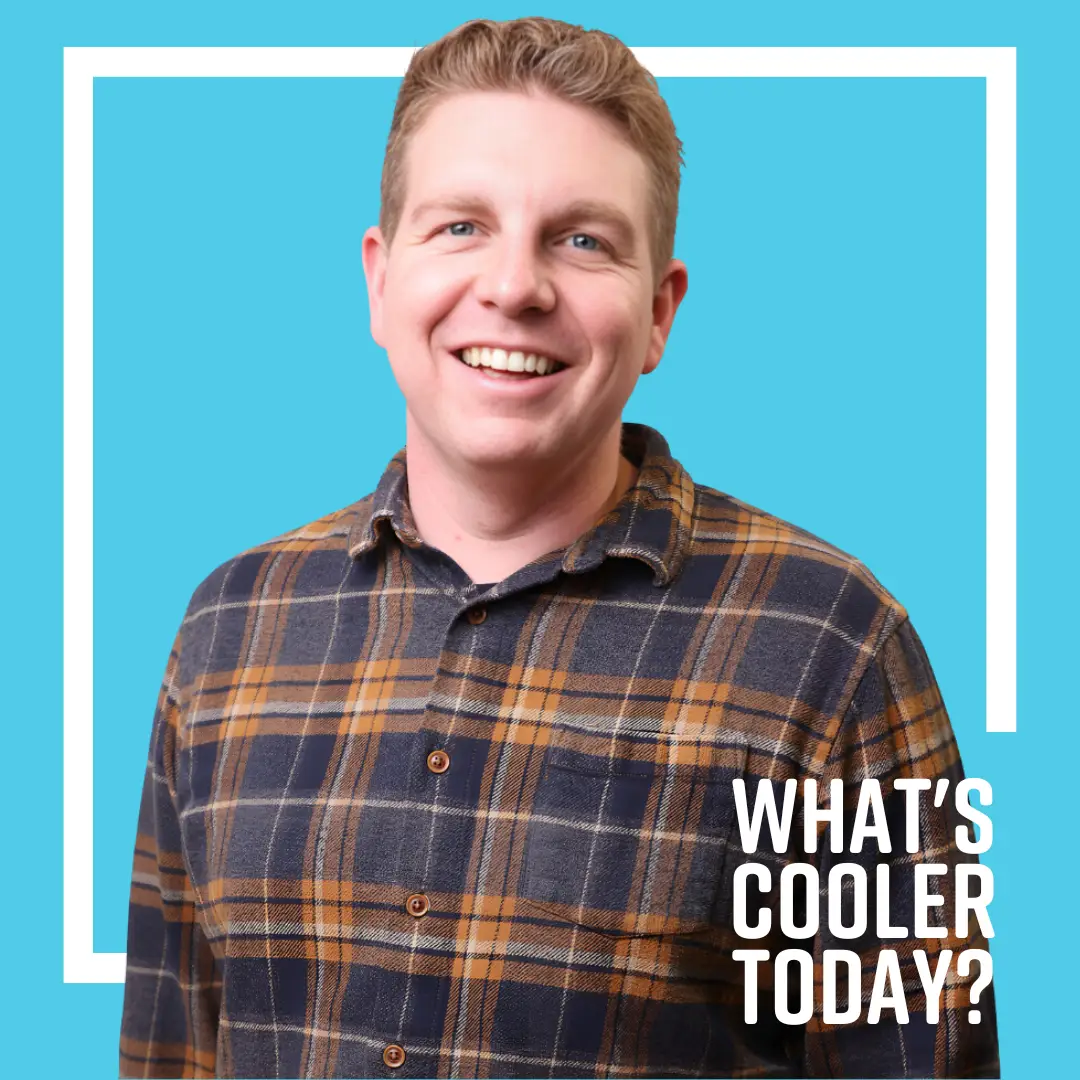 Grand Forks "What's Cooler Today" Article Author Paul Stands in Front of Blue Background
