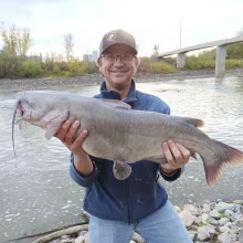 wade-fishing-on-the-red Wade Anderson showing off a nice Channel Catfish from the riverbank near the pedestrian walking bridge in East Grand Forks.