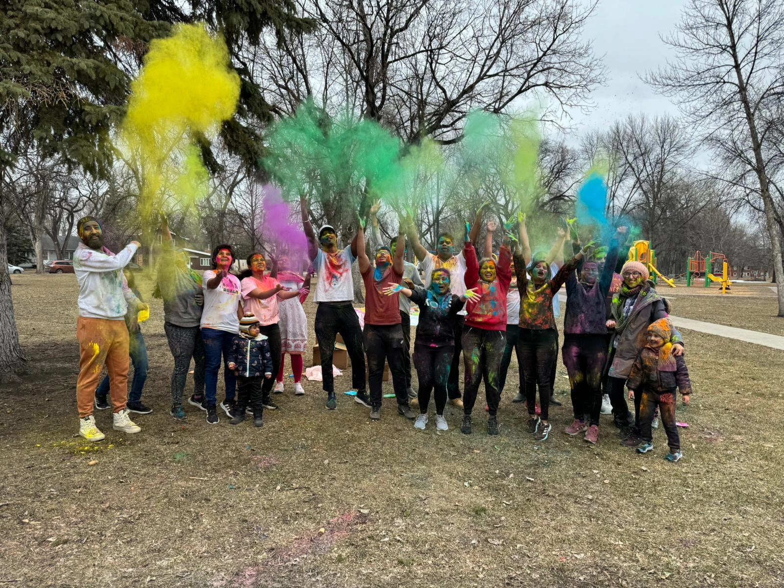 international-students-in-grand-forks-student-association International Students in Grand Forks throwing colored dust into the air.