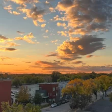 Photo of blue and orange sunset with clouds from Pure North apartments in Grand Forks.