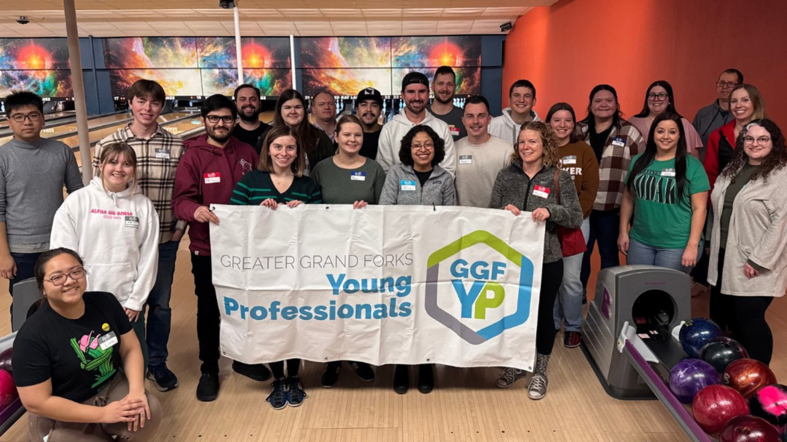 GGFYP group photo where the author has attended a bowling event with them.