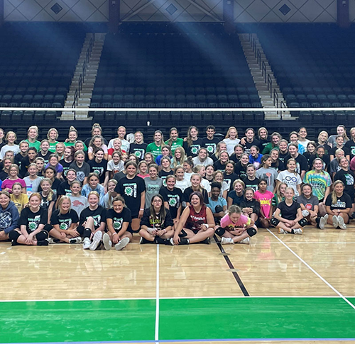 UnD volleyball camp group photo The entire group for UND Volleyball camp stands together for a photo inside the gym