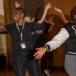 Member of InternGf dances to Zumba at Choice Fitness