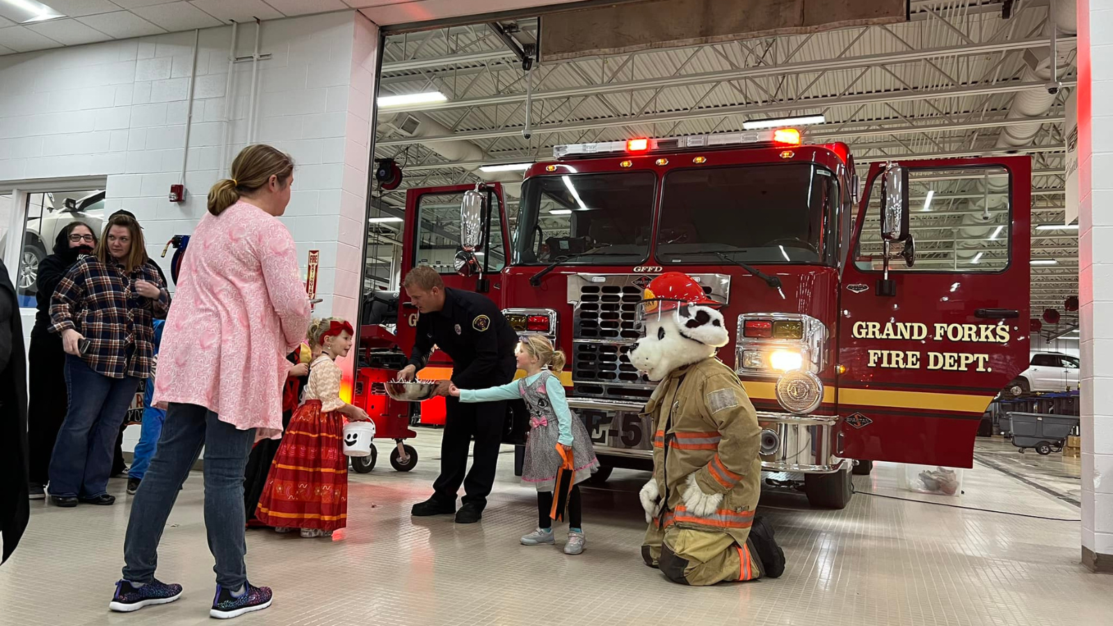Trunk of Treat Photo Trunk of Treat at the Fire Station photo! The dalmation mascot for the fire station hands out candy for kiddos dressed up for Halloween!