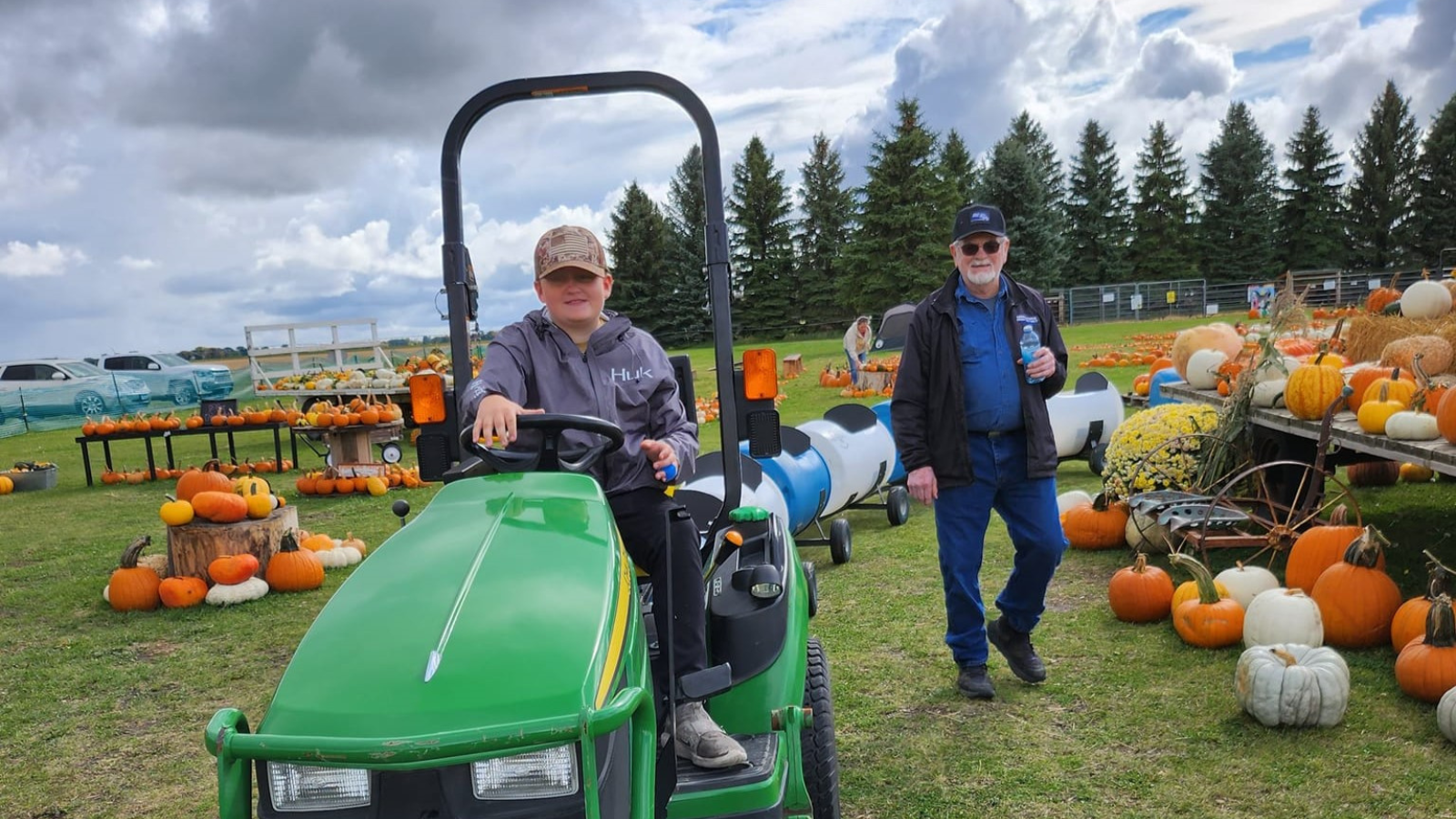 Patch on the Point Patch on the point tractor train pictured with a bunch of pumpkins surrounding the path of various colors.