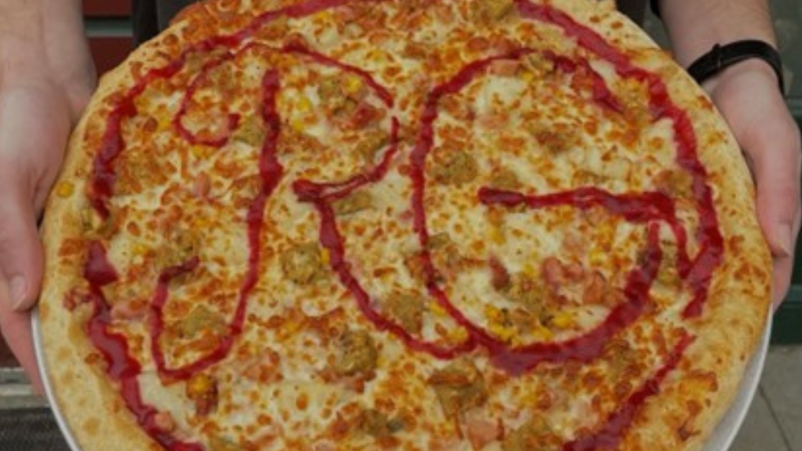 Rhombus Guys Photo Rhombus Guys close up of a yummy pizza with their RG letters spelled out across the pie!