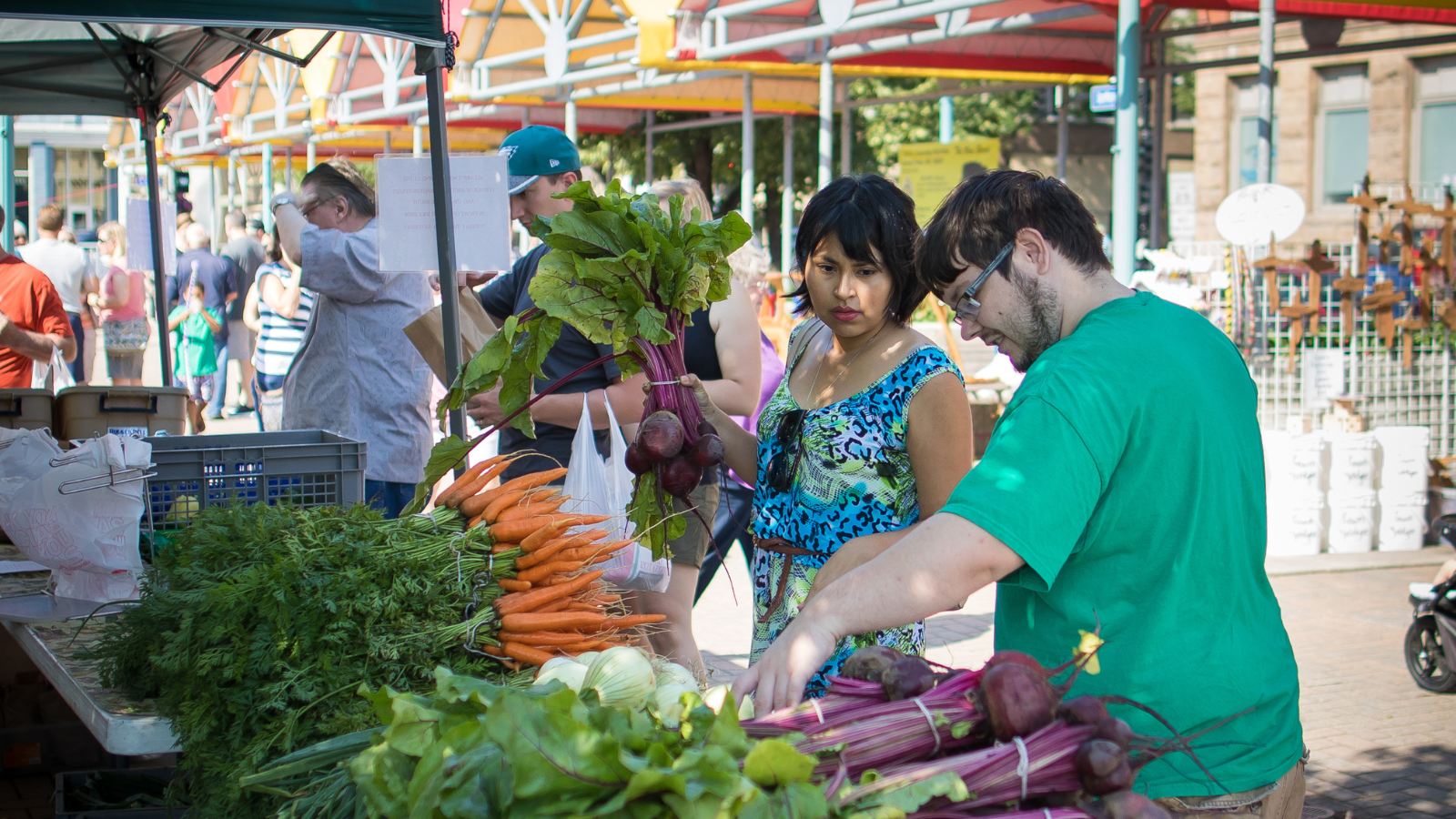 Farmer's Market Photo Farmer's Market Photo two people picking out fresh veggies