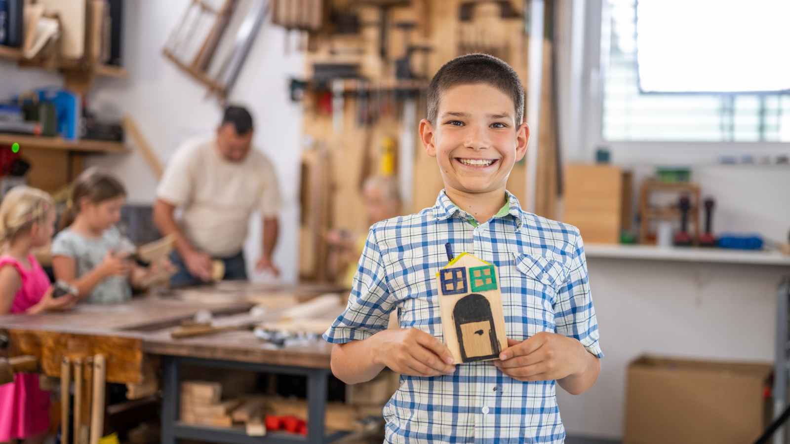 Kidpreneur smiles at camera Kidpreneur smiles at the camera holding their craft.