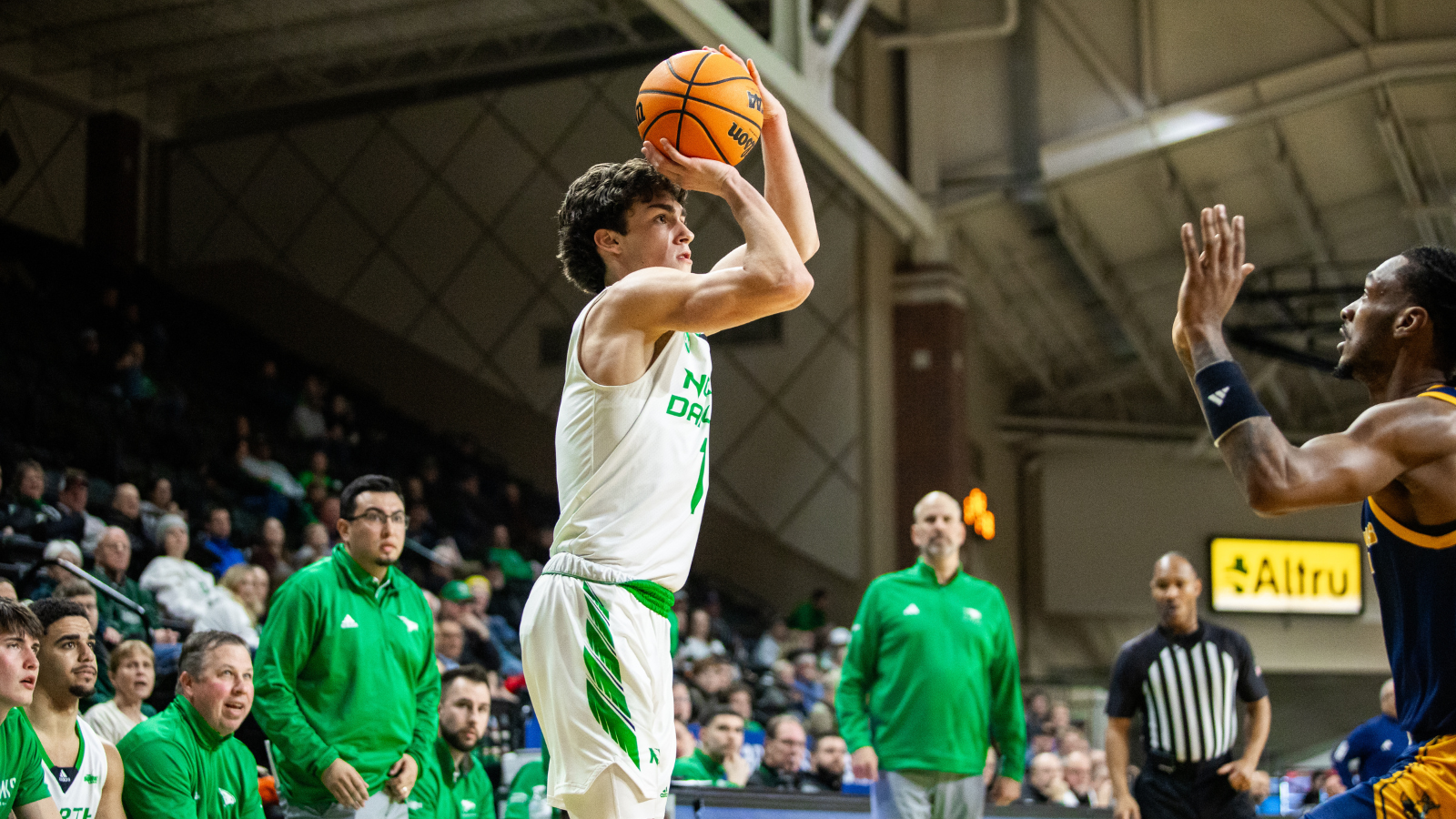 UND Men's Basketball Game UND Men's basketball player sets up for a shot at the basket